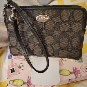 Coach Wristlet in Signature Black.